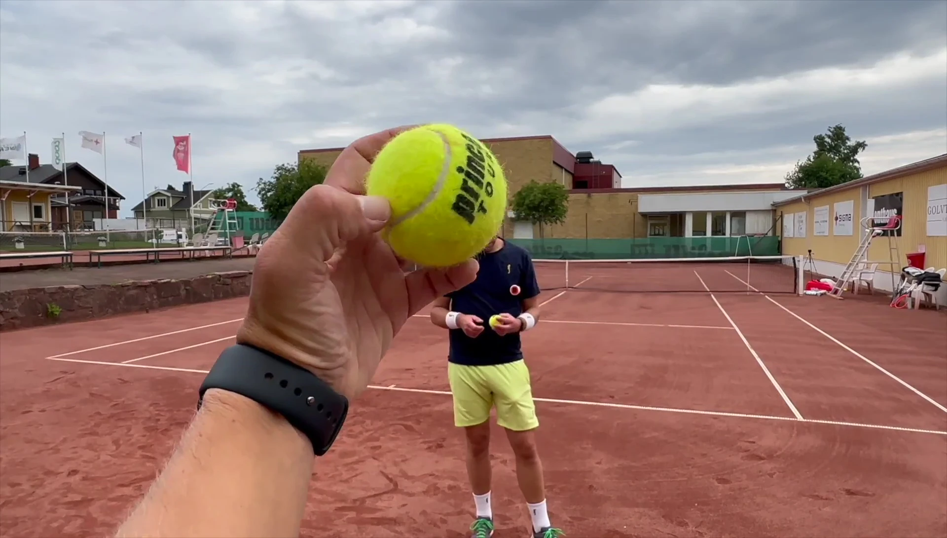 Player hitting a Prince Tour tennis ball