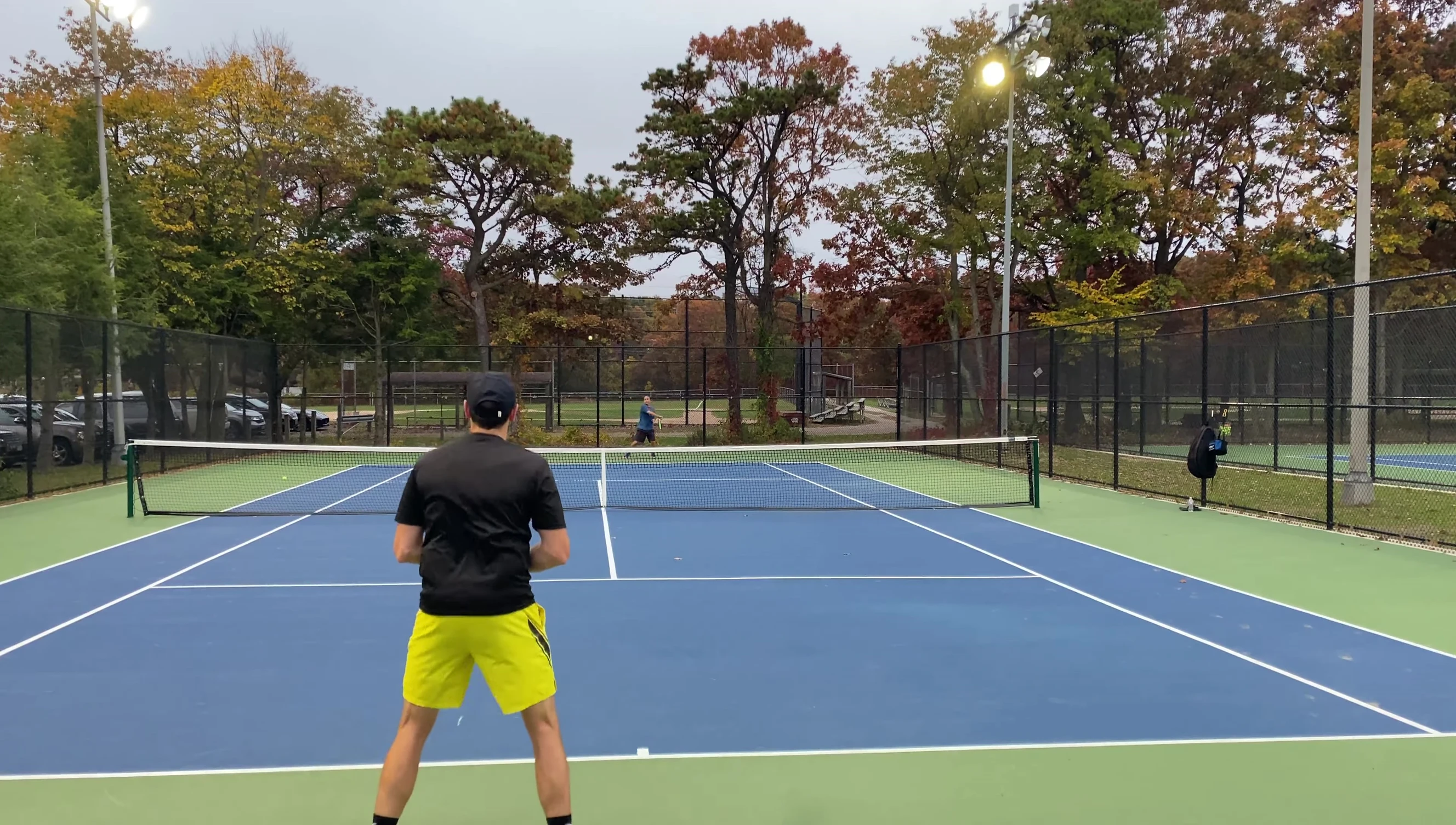 Shot of the reviewer holding up the tennis ball at the end of the video.