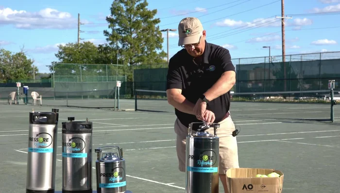 Pressurize: Connect the Pressure Refresher to a regulator set at 50 PSI. Pressurize up to 25-30 PSI (you'll hear the balls moving). Continue to 40 PSI.