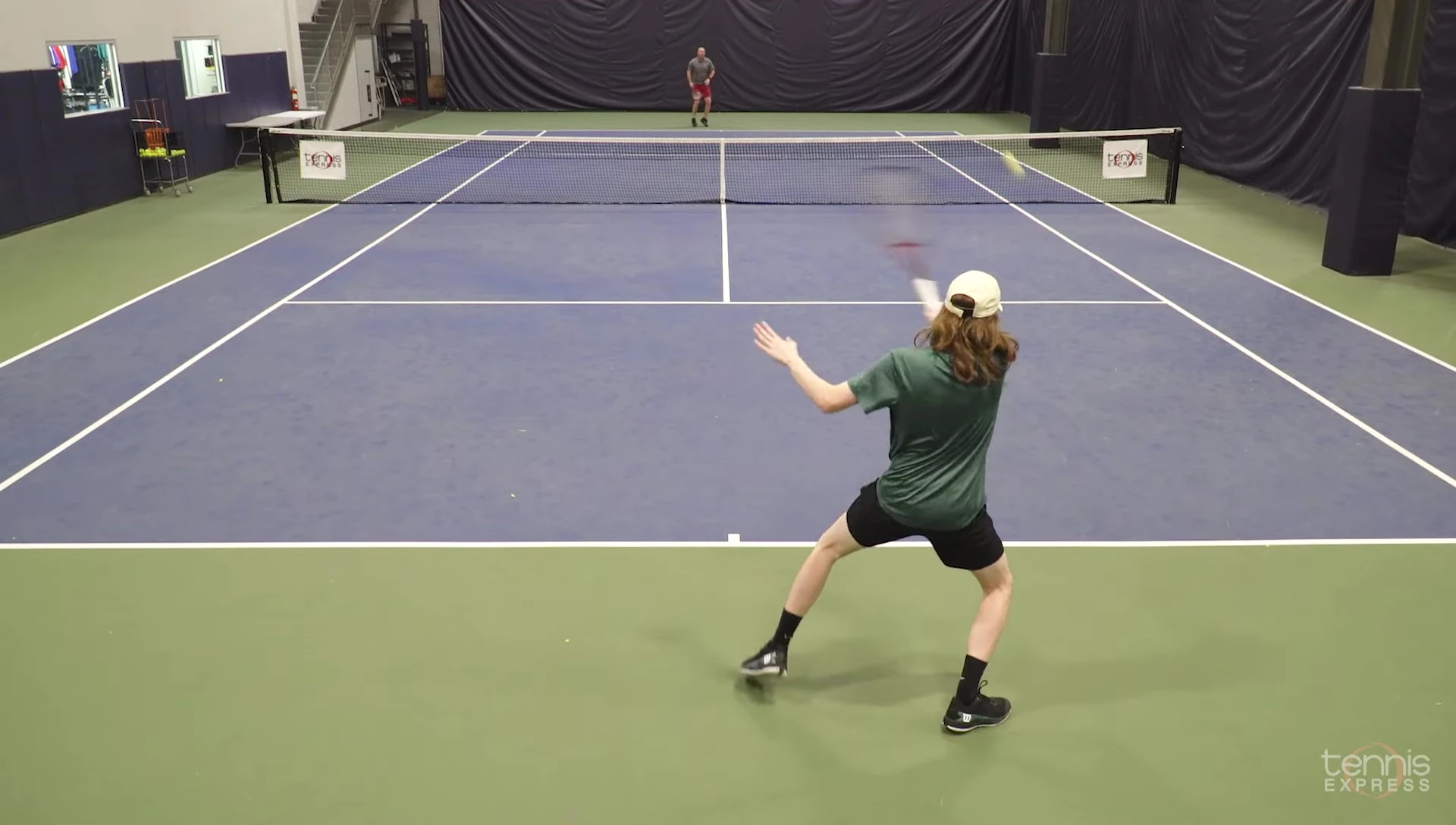 Player hitting the ball with a Wilson Clash V3 racket, showcasing its power and feel.