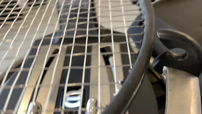 Complete the stringing process.