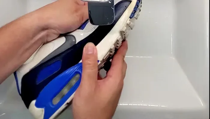 Rinse and repeat the process until satisfied. The sneakers will appear whiter once all the toothpaste is rinsed away.