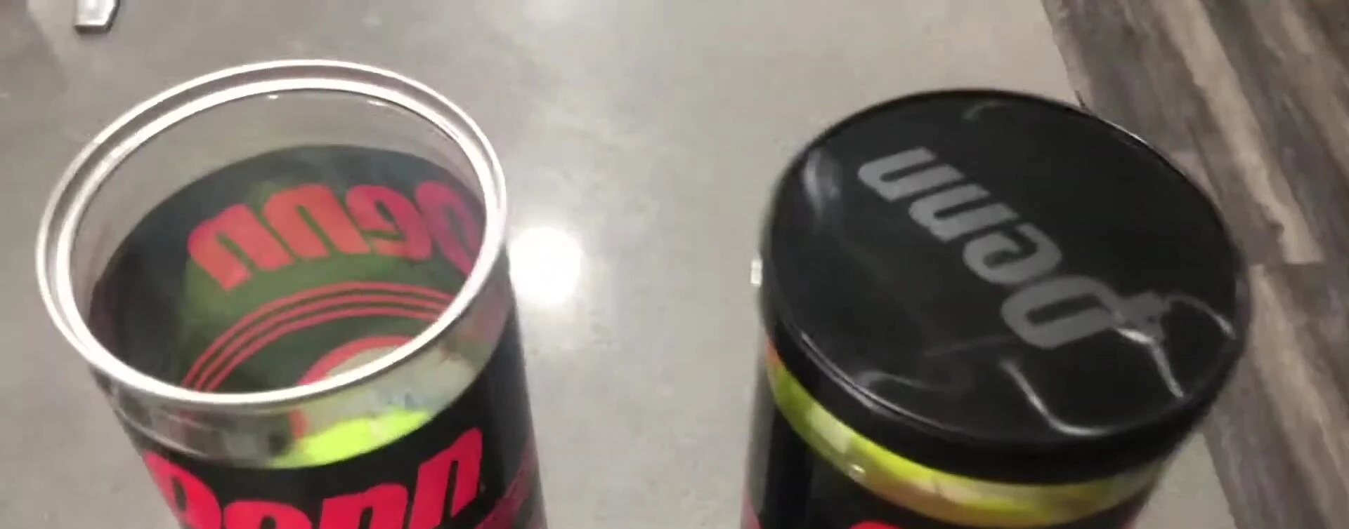 A tennis ball with the Penn logo clearly visible.