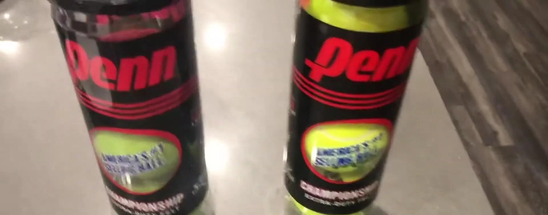 Stacked cans of tennis balls.