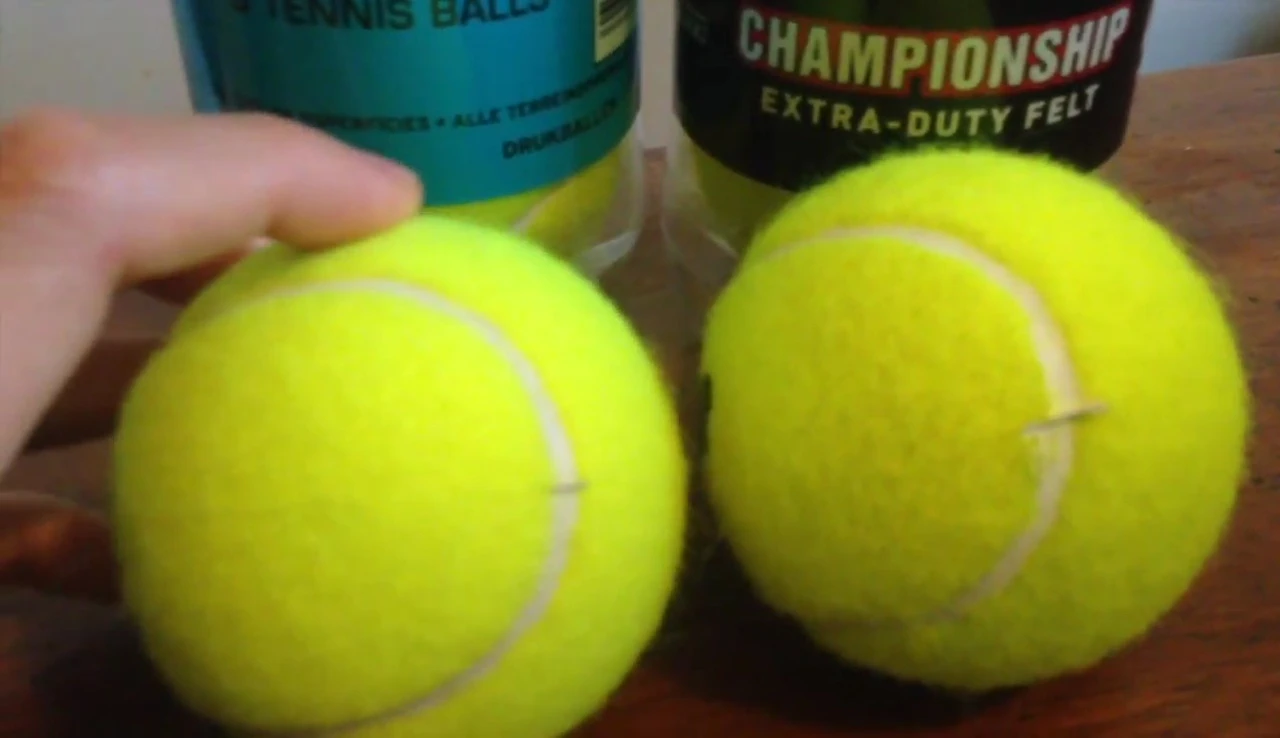 Another close-up shot comparing the condition of the tennis balls.