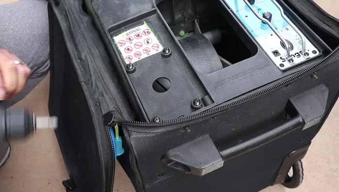 Remove the control panel and circuit board by removing four screws and unplugging the USB connector.