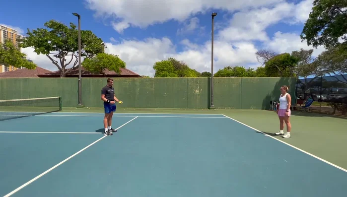 React to the throw, get up quickly, and catch the ball before it bounces twice.