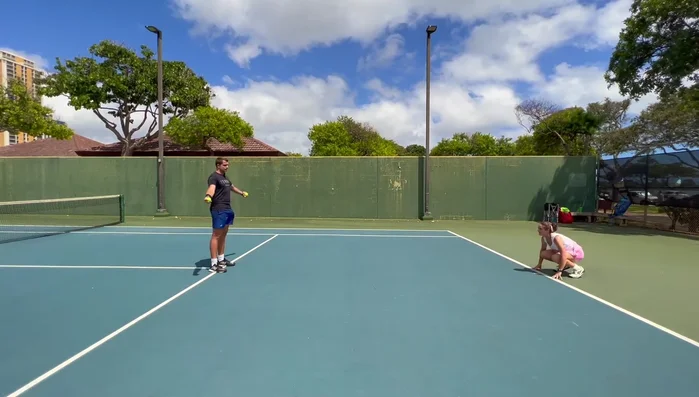 React to the throw, get up quickly, and catch the ball before it bounces twice.