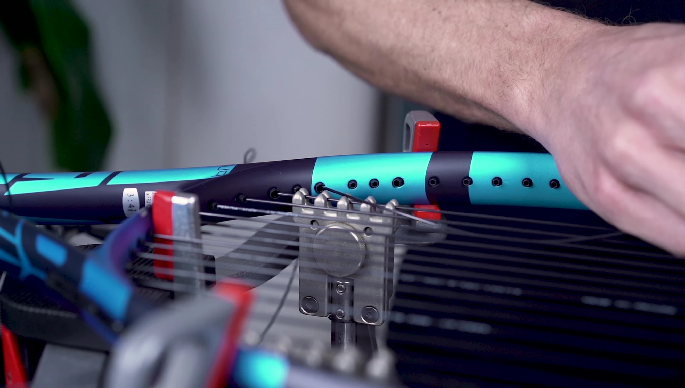 The reviewer holding the Babolat Pure Drive 2021 racket