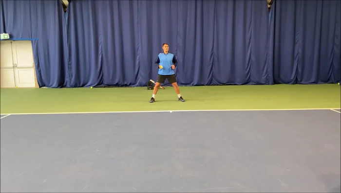 Player picks up the ball and returns to starting position quickly.