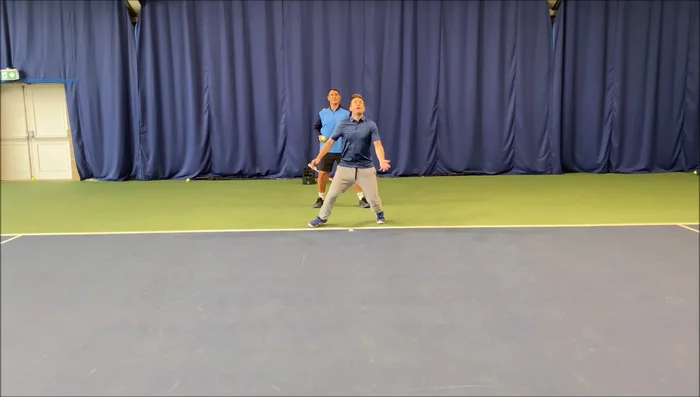 Player catches the ball before it bounces.