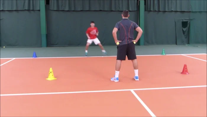 The player reacts explosively and taps the cone.