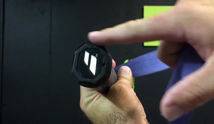 Overlap the grip by about an eighth of an inch with each turn, maintaining steady pressure.