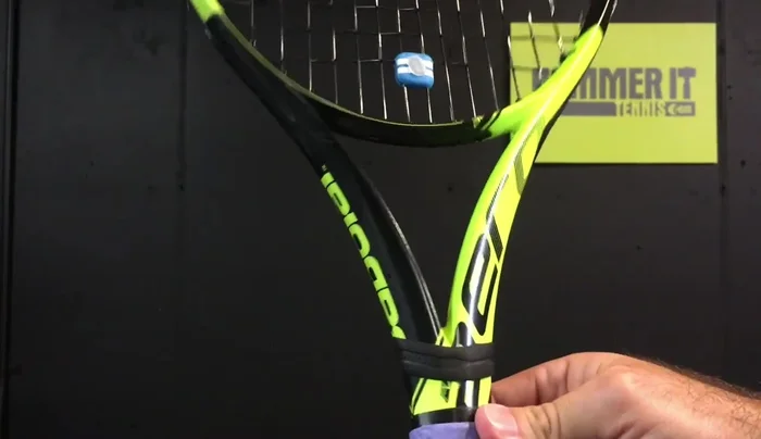 Fold the excess grip under, secure it with the rubber band provided.