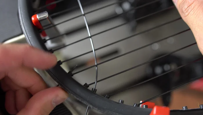 Begin with the Parnell Knot (or 'Starting Knot'): This knot is crucial for efficient cross stringing, securing the string at the top of the racket.