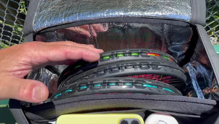 Demonstrating the shoe compartment and adjustable shelving.