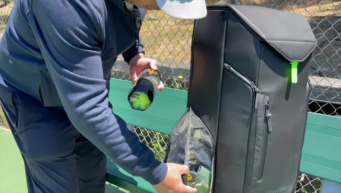 Demonstrating the shoe compartment and adjustable shelving.