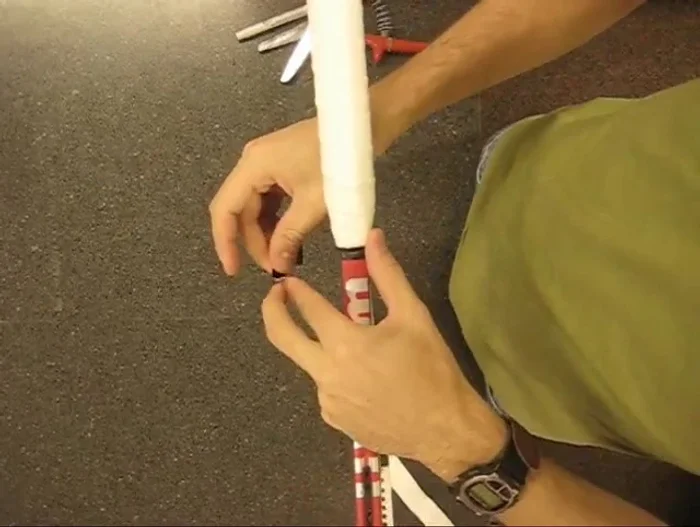 Cut finishing tape: Cut the finishing tape at an angle to secure it neatly.