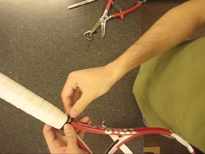 Cut finishing tape: Cut the finishing tape at an angle to secure it neatly.