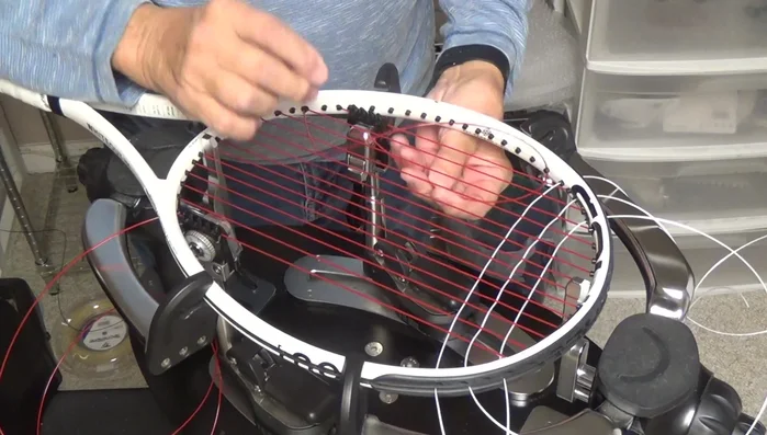 Remove the bulge on the outside of the string channel by pulling tension on the string.