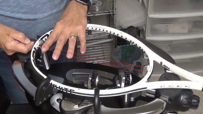 Remove the bulge on the outside of the string channel by pulling tension on the string.