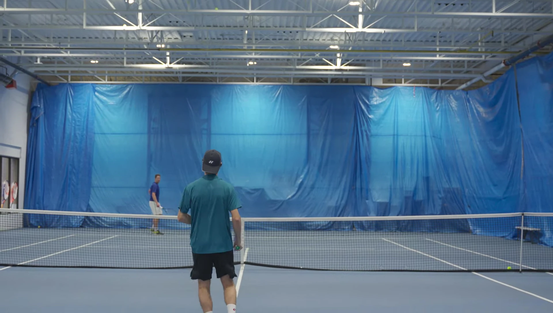 Player executing a serve with the 8th generation racket.