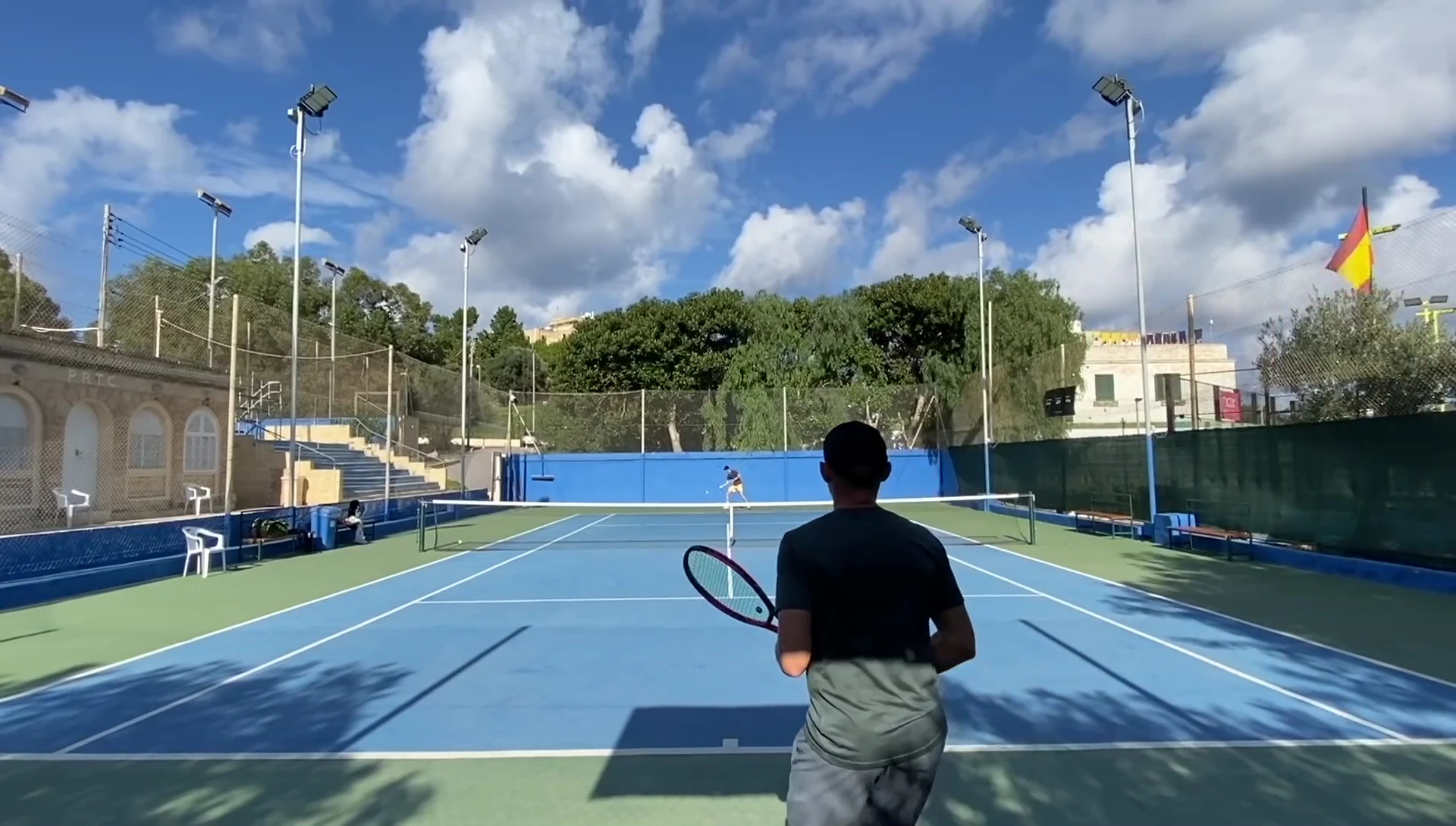 Overall shot of the Yonex VCore 98 racket, highlighting the blue accents