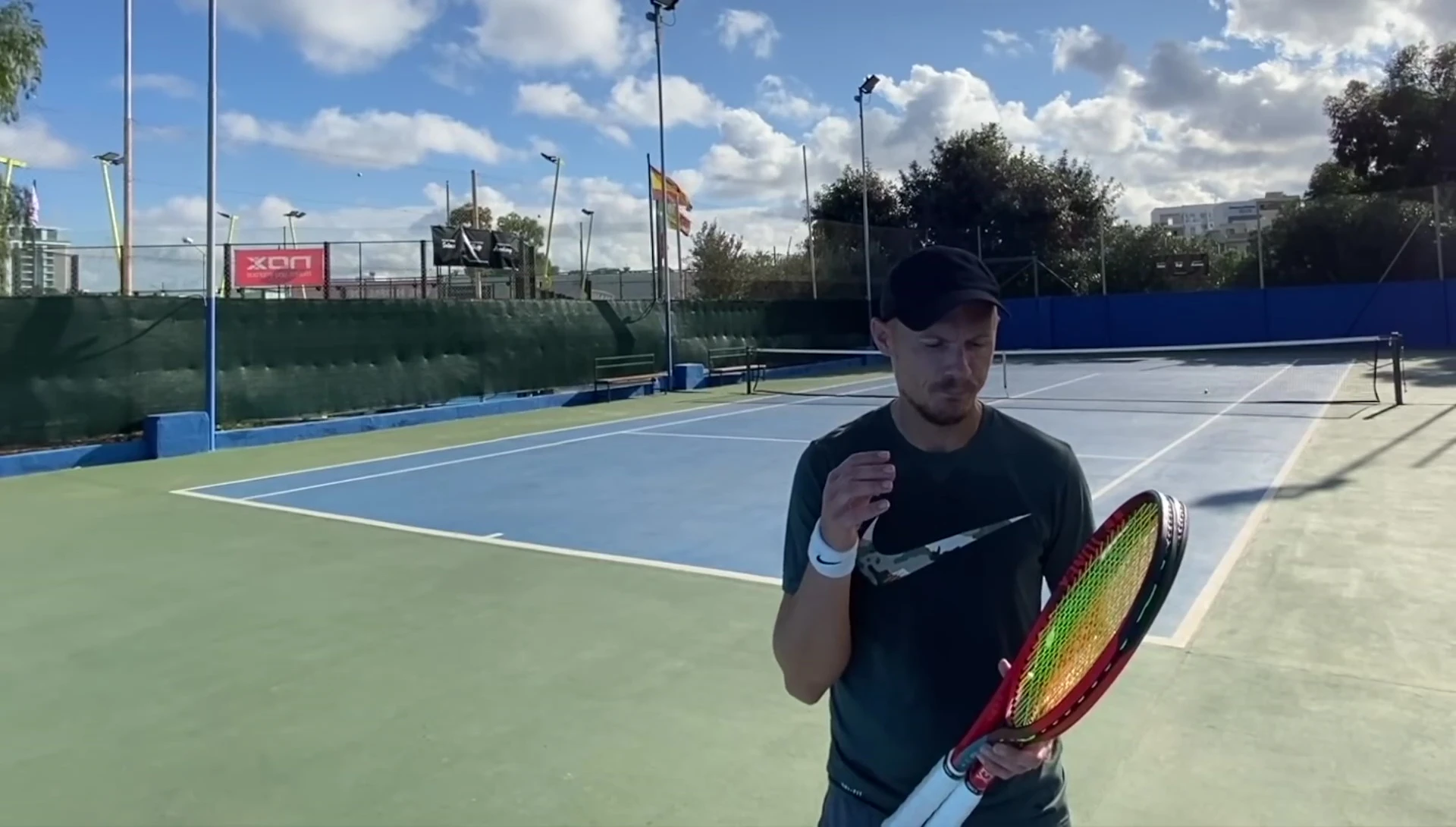 Close-up shot of the Yonex VCore 98 racket in hand