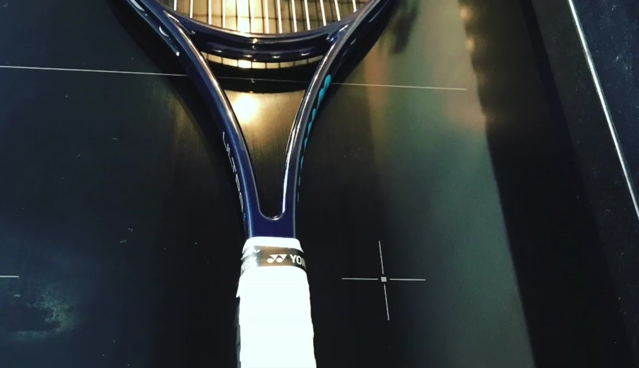 Image showing lead tape being applied to the racket