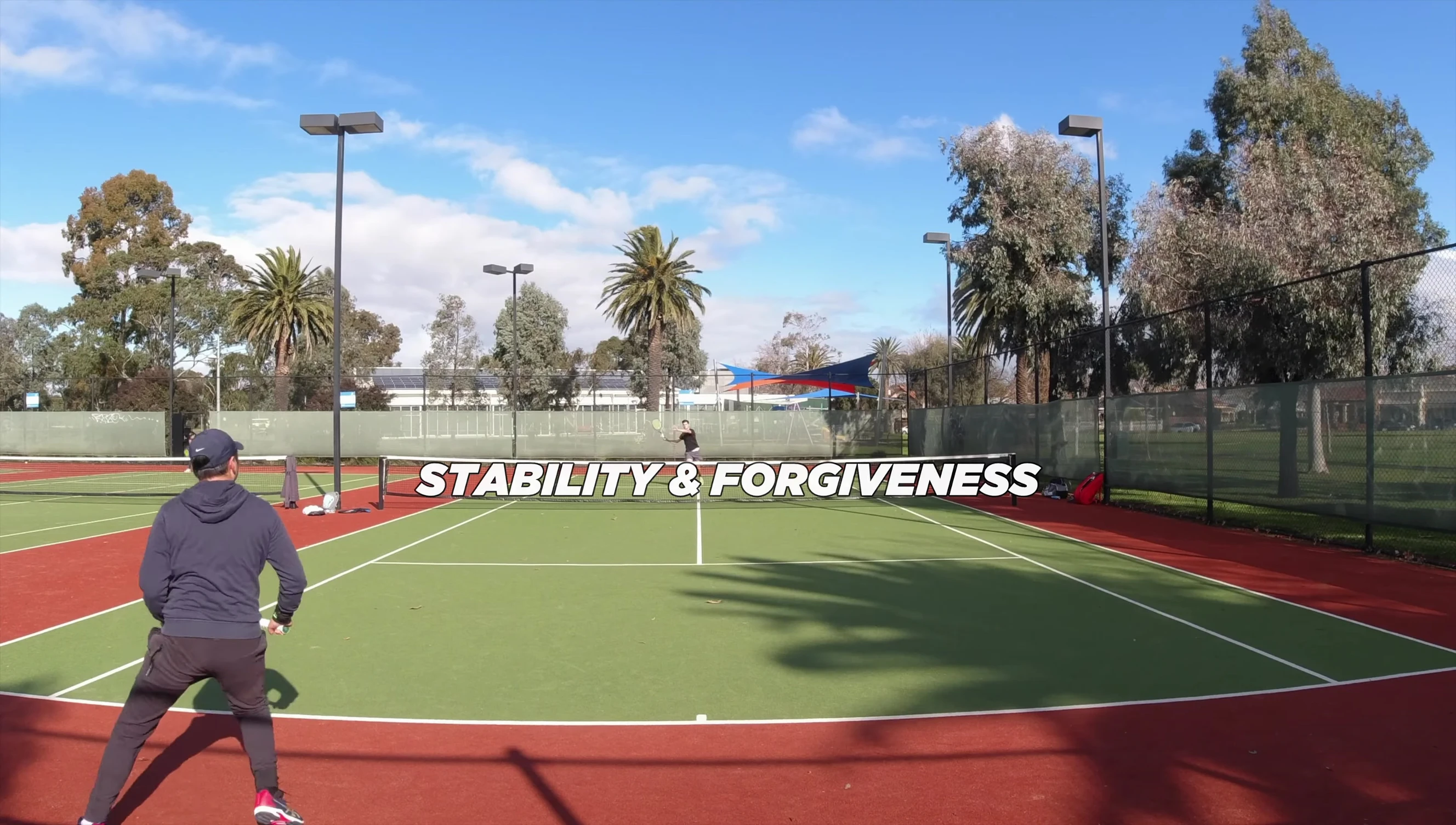 The reviewer demonstrates the stability of the racket.