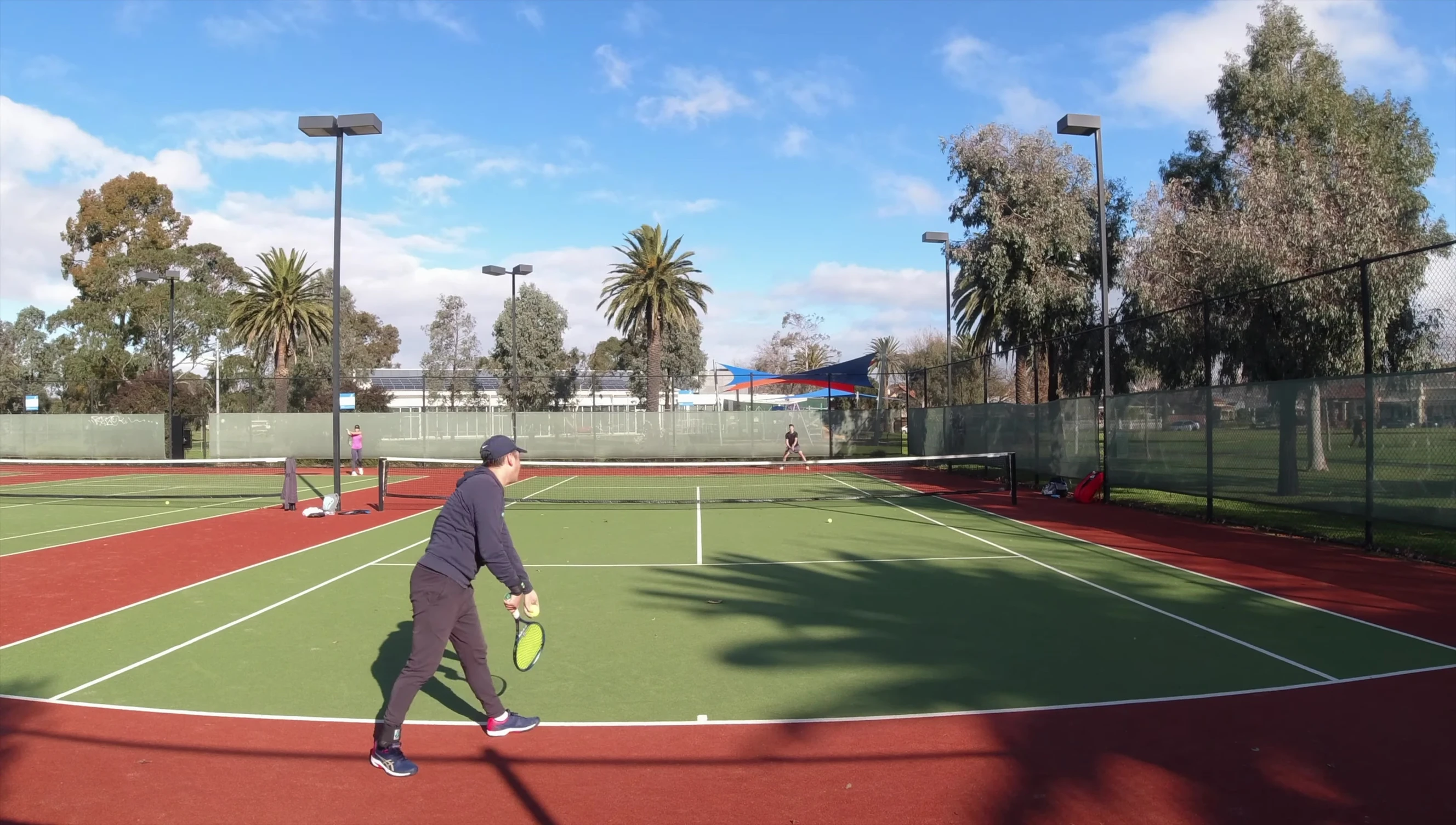 The reviewer volleying with the racket.