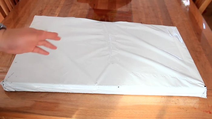 Unpack the tennis ball trolley from its box.