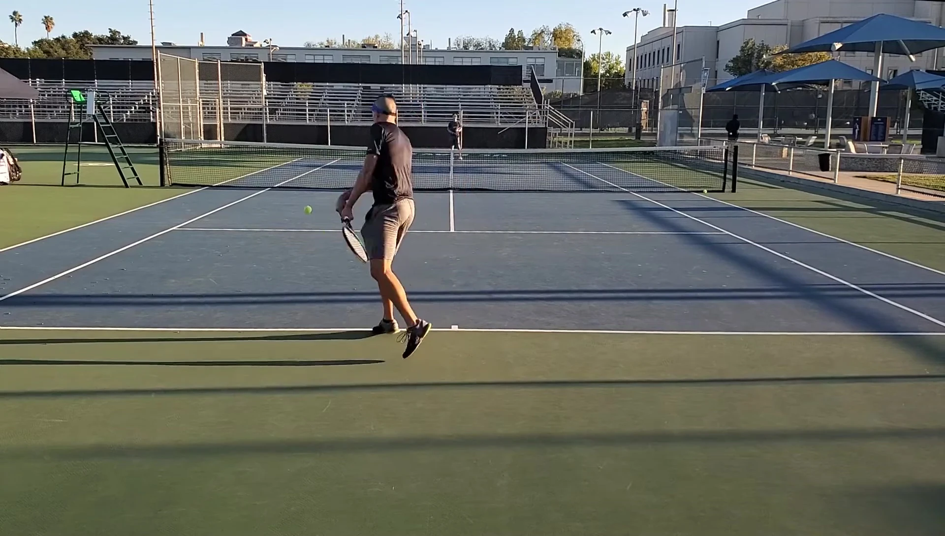 The reviewer comparing the different rackets