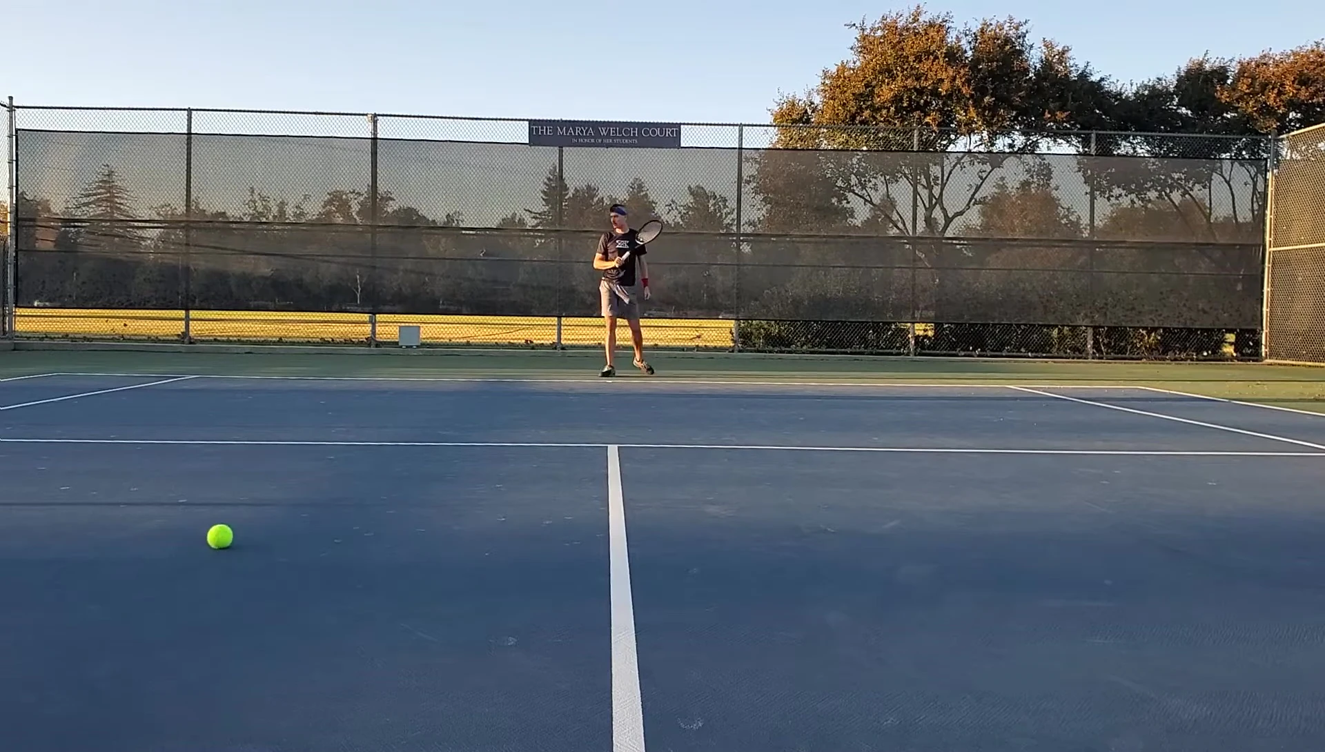 The reviewer hitting the ball with the EZONE racket