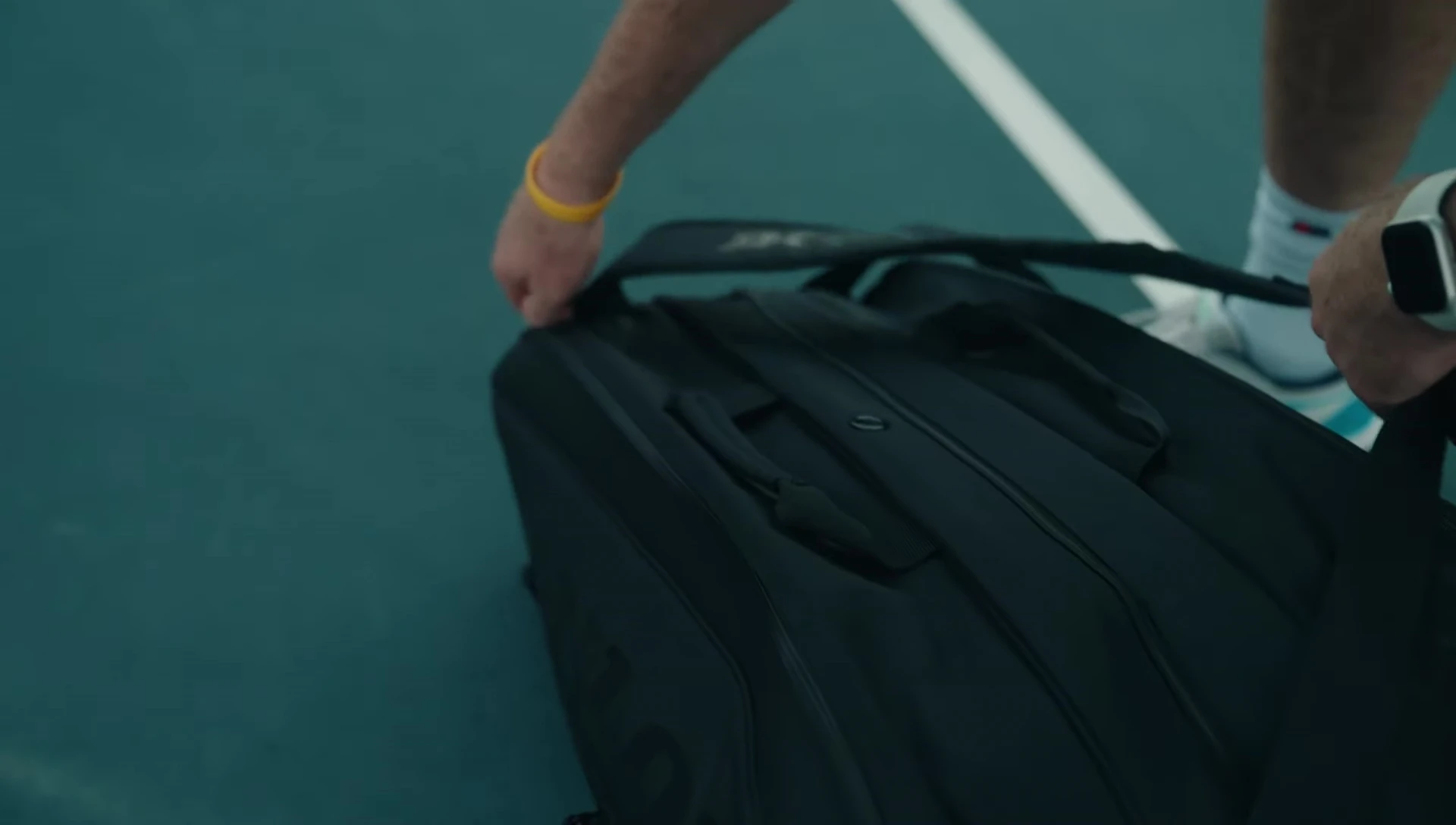 Close-up of the Dunlop Team 12 bag's interior, focusing on the insulated pocket