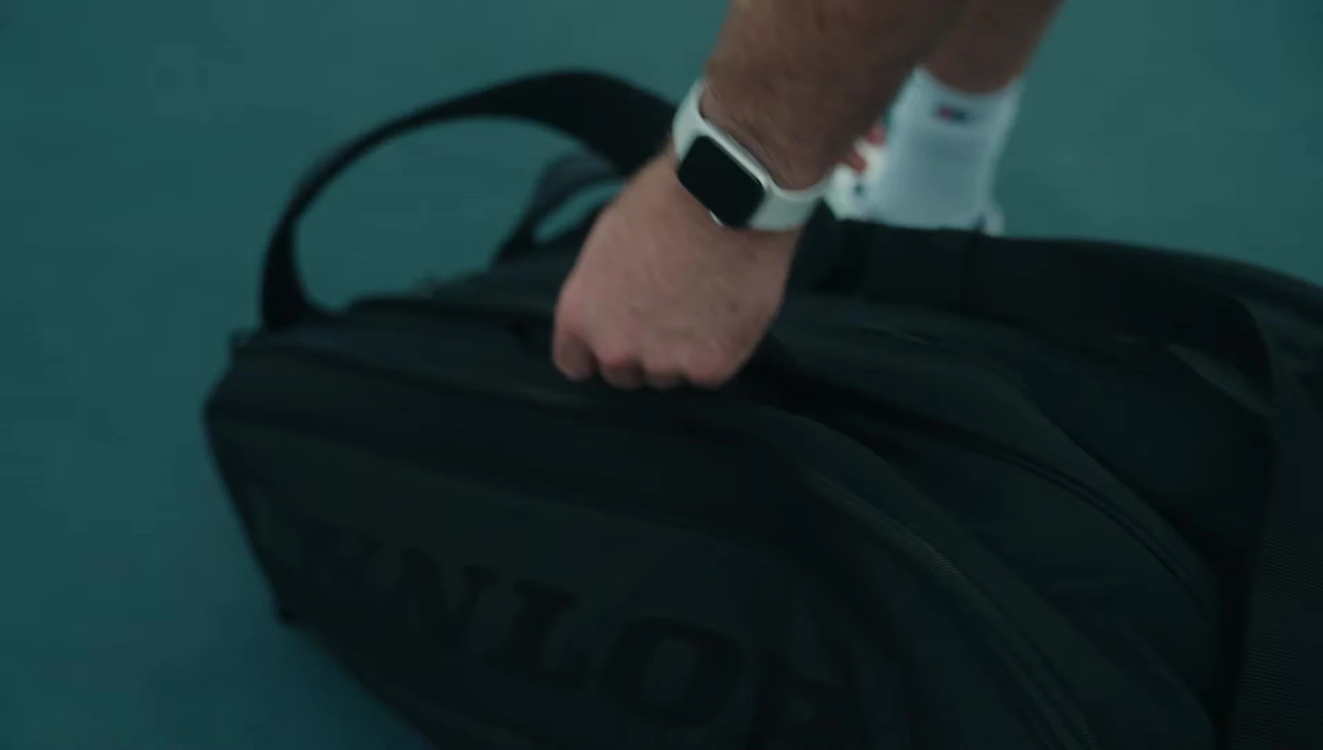 The Dunlop Team 12 bag being carried to show its handles and ventilation