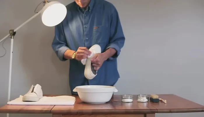 Use a damp cloth to remove surface dirt from the shoes.