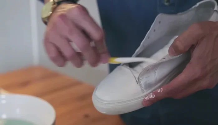 Remove toothpaste foam with a clean damp cloth and let dry.