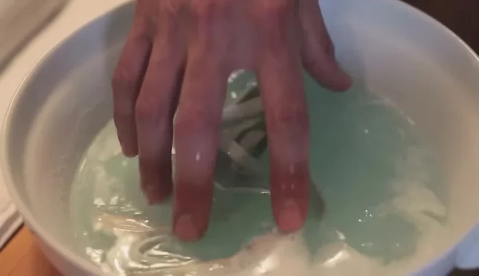 Remove laces from the bowl and let them dry.