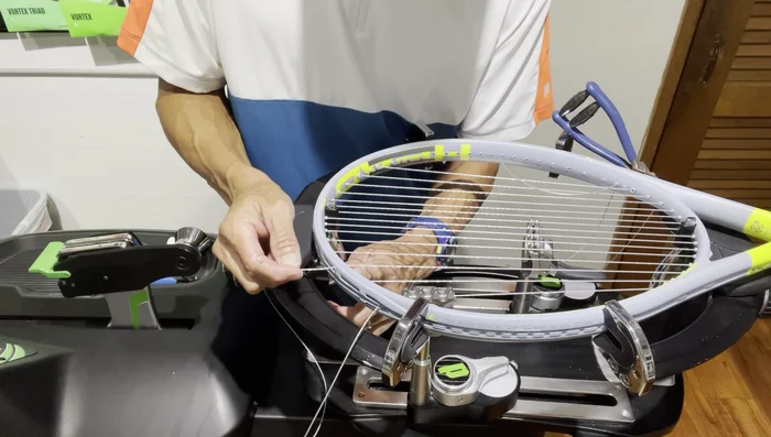 On the short side, install the top three crosses. Weave the strings, ensuring a downward angle to reduce friction.