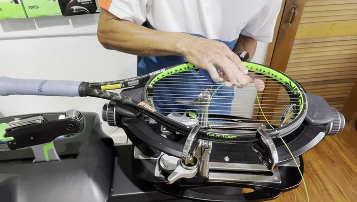 Measure approximately four feet of string. Create a loop.