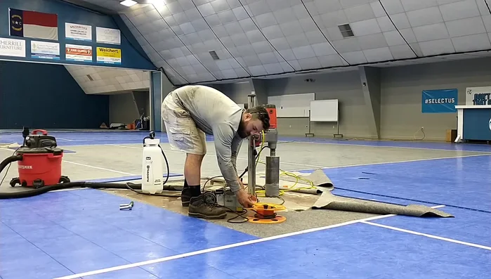 Connect vacuum pump: Attach the vacuum pump to create suction, preventing the drill from moving during operation.