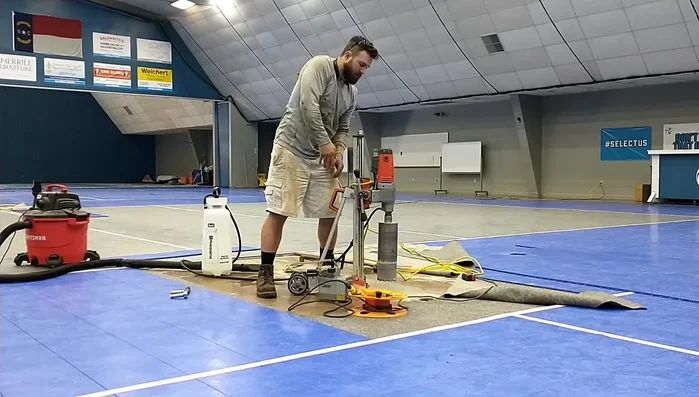 Pre-wet the floor: Lightly wet the area around the drill bit to help with the drilling process.