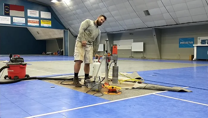 Pre-wet the floor: Lightly wet the area around the drill bit to help with the drilling process.