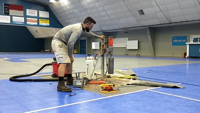 Install sleeve and concrete: Place a sleeve into the drilled hole, followed by additional concrete to secure it.