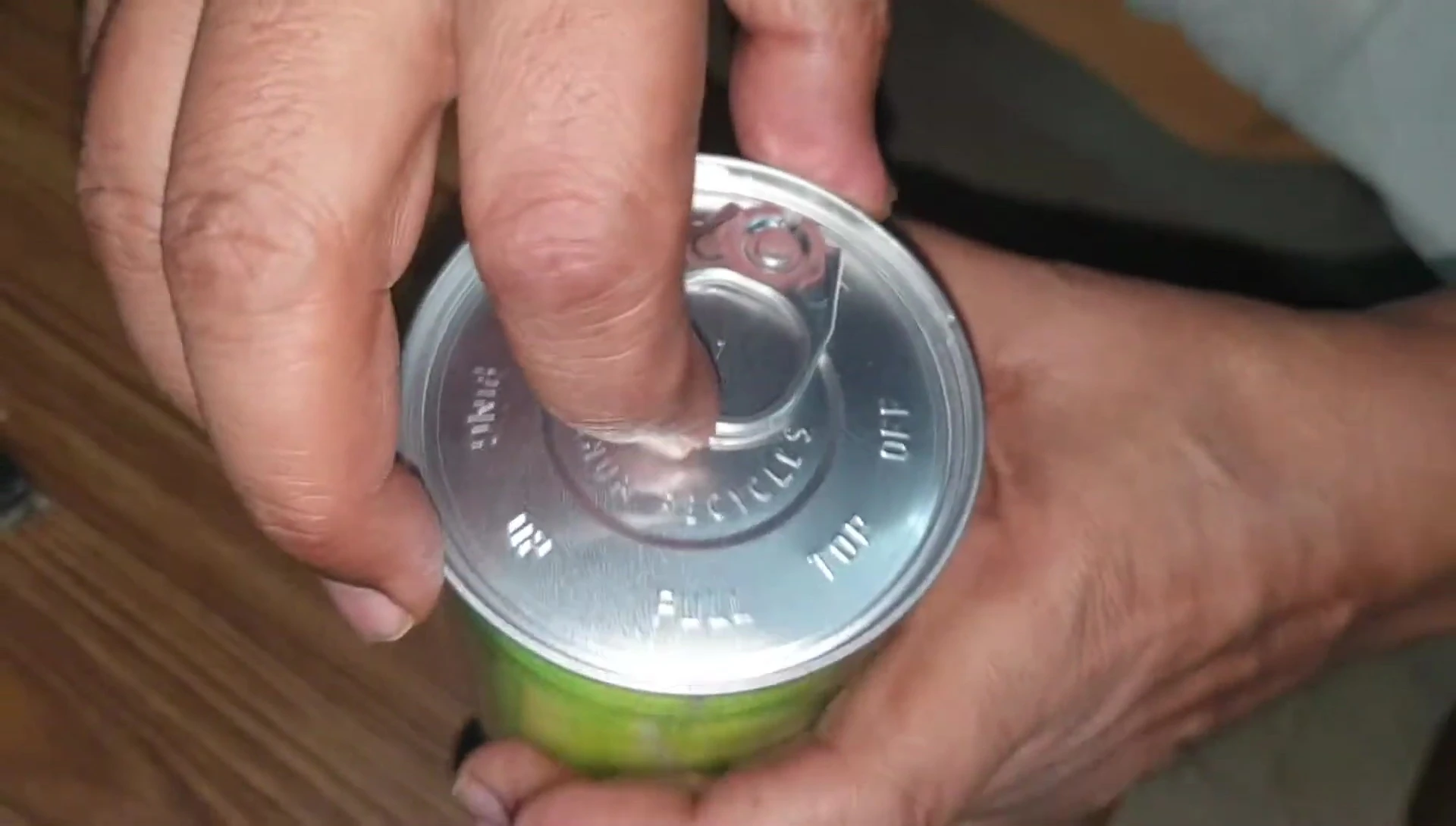 Image of someone opening the packaging of the tennis balls