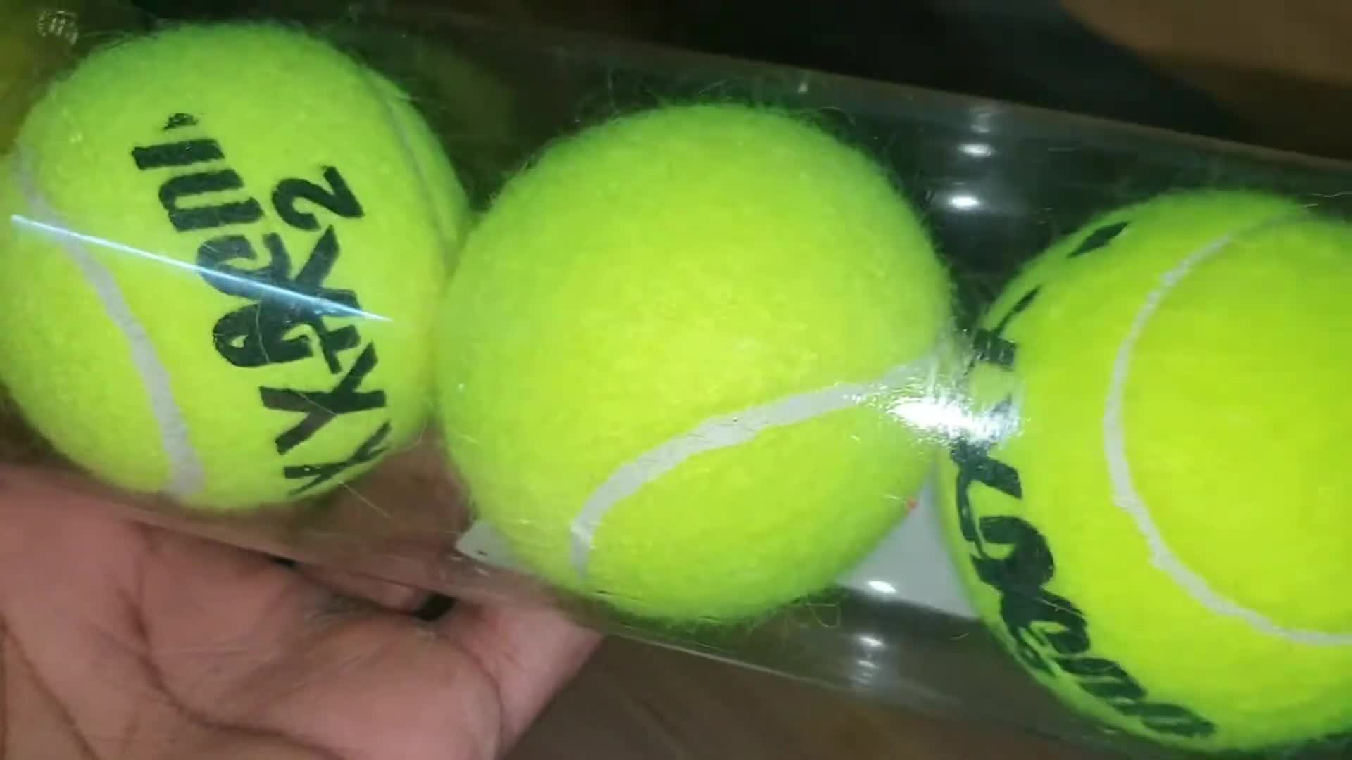 Close-up of the X Out tennis balls packaging