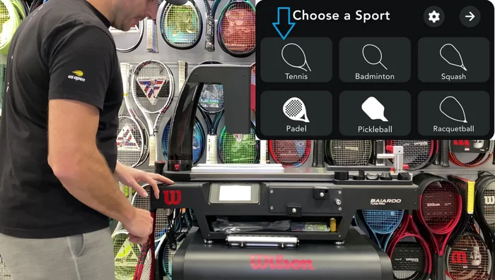 Attach the larger piece, matching it to the actuator head. Adjust for racket length.