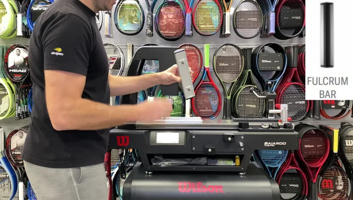 Attach the larger piece, matching it to the actuator head. Adjust for racket length.