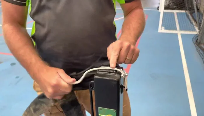 Guide the cable through the little guide on the neck hook side.